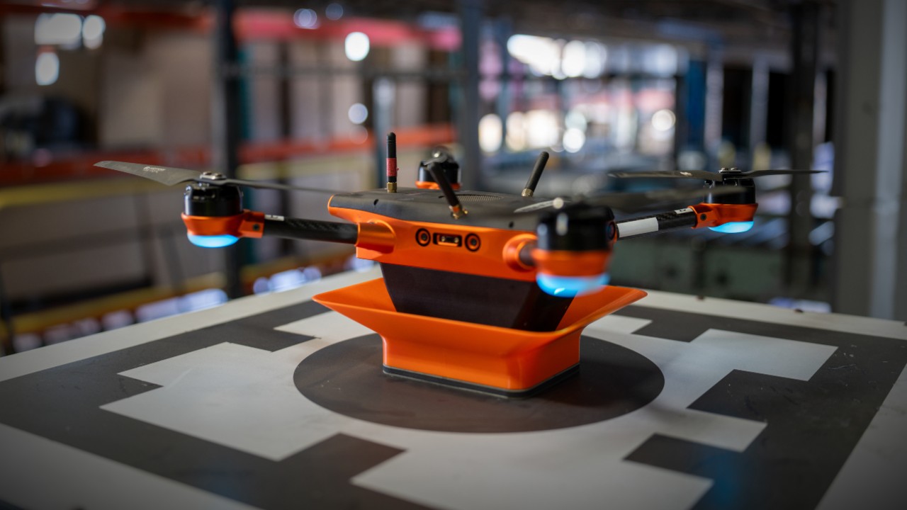 A Corvus One inventory drone recharges on its landing pad.