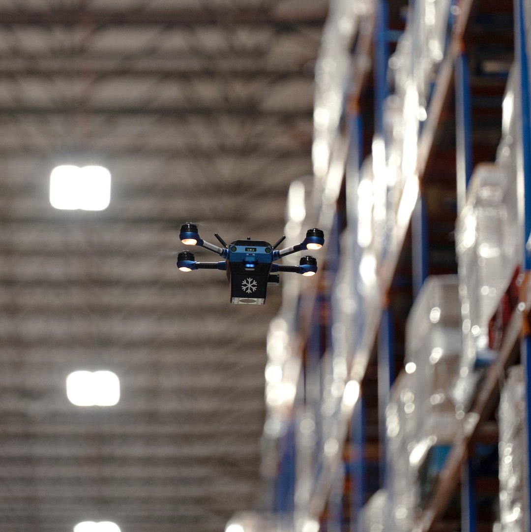 A Corvus One for Cold Chain Inventory drone performs a cycle counting mission in a freezer, scanning pallets of inventory stored on racks