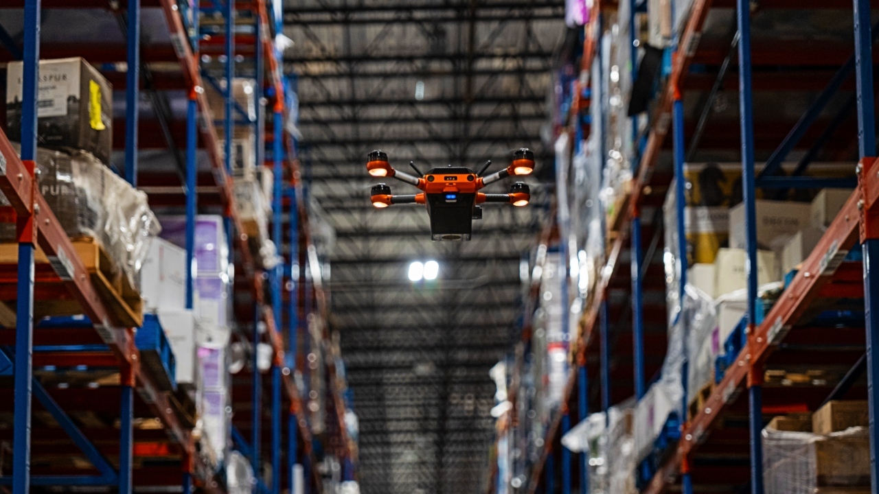 A Corvus One autonomous inventory drone scanning warehouse racking at Southern Glazer’s Wine & Spirits distribution center, enabling real-time inventory visibility in a high-bay storage environment