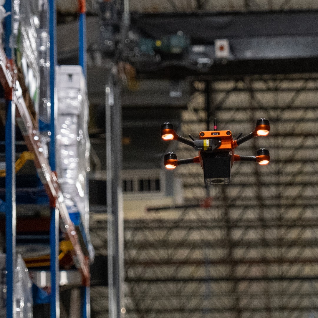 A Corvus One AI-powered warehouse drone performing autonomous inventory scanning inside a Southern Glazer’s Wine & Spirits distribution center, improving inventory visibility and operational efficiency